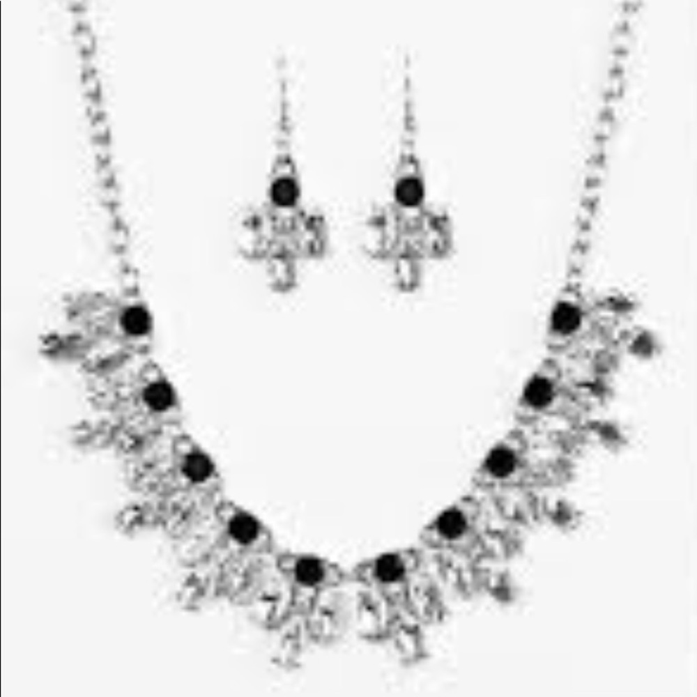 Glittery white rhinestones flare from the bottom of classic black rhinestones.